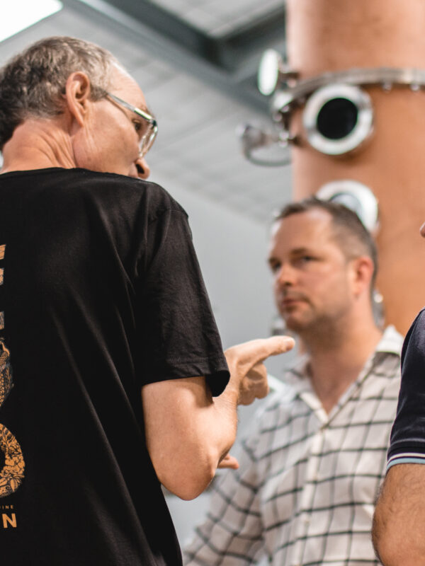 Taranaki Story 055 Food Do Business Dave James Juno Gin conducting distillery tour with visitors